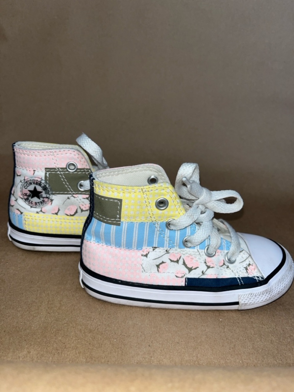 Converse Kids High-Top Sneakers in White with Pink, Blue, and Yellow Accents